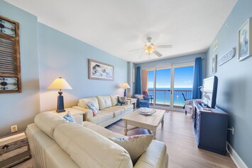 Bright and relaxing living room that opens directly onto the spacious balcony.