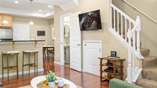 A spacious living area with a kitchen, dining area, and a staircase. - Bryant Creek Escape-Minutes from downtown (Walla Walla)