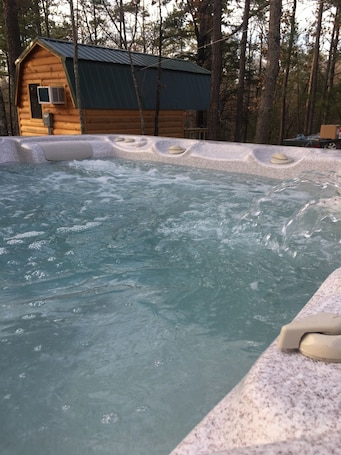 Outdoor spa tub. Adjacent to Hugo lake Corp land. These cabins do not have bathrooms in them.