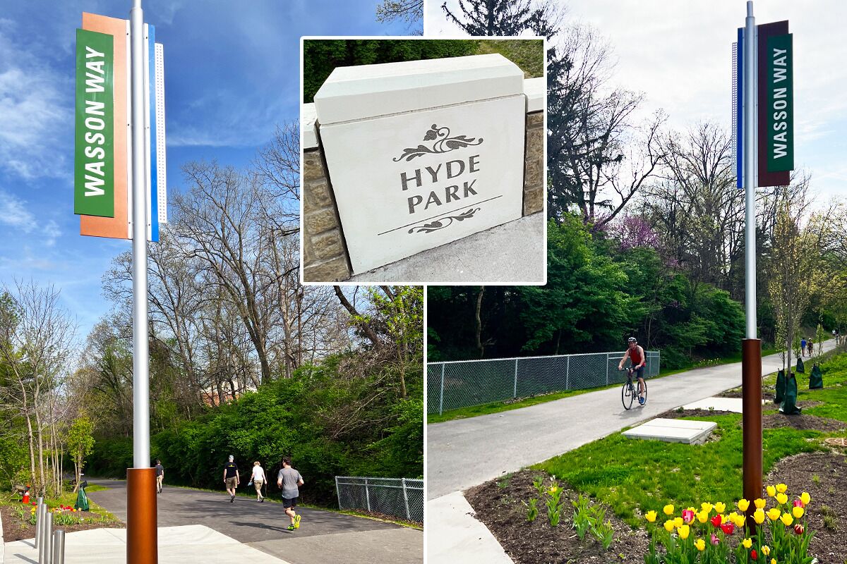 Un panneau indiquant l’entrée de Hyde Park, avec un panneau indiquant la direction de « Wasson Way » à proximité.