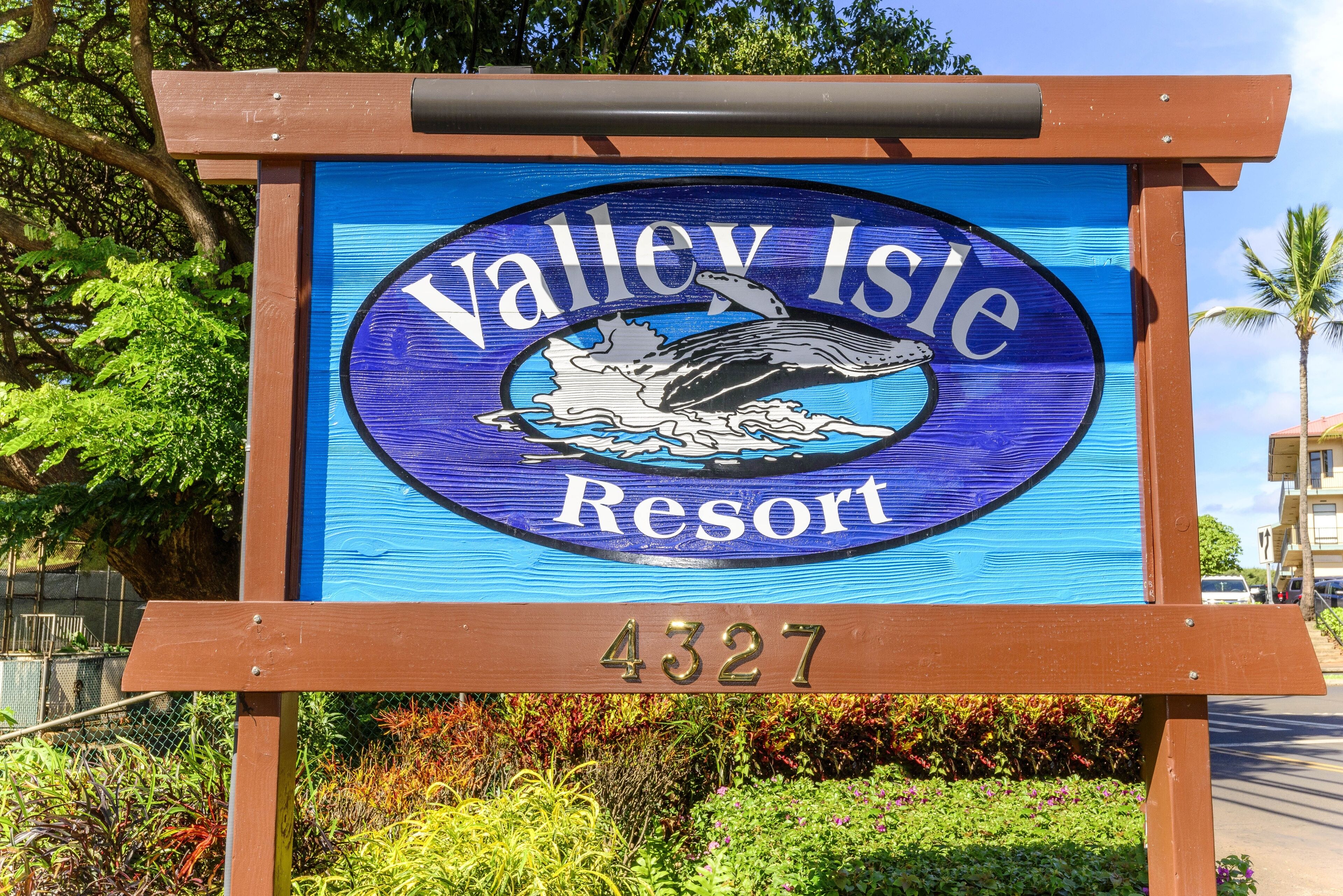 A sign for Valley Isle Resort with a whale graphic and the number 4327.