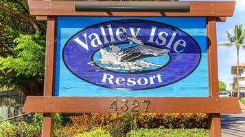 A sign for Valley Isle Resort with a whale graphic and the number 4327.