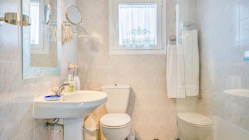 Bathtub, hair dryer, towels