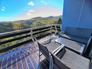 Kamer, 1 slaapkamer, patio, uitzicht op tuin | Balkon