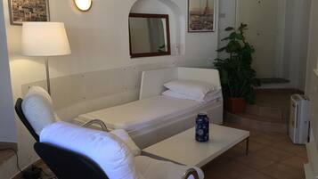 Studio, Multiple Bedrooms, Smoking | Living area | TV