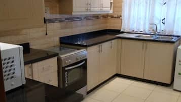 Apartment, 3 Bedrooms, Smoking, Terrace | Private kitchen | Fridge, microwave, electric kettle, cookware/dishes/utensils