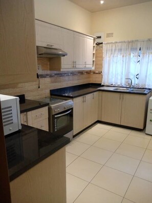 Apartment, 3 Bedrooms, Smoking, Terrace | Private kitchen | Fridge, microwave, electric kettle, cookware/dishes/utensils - 3 Bedrooms Exclusive Apartment in Kaludu (Lusaka)