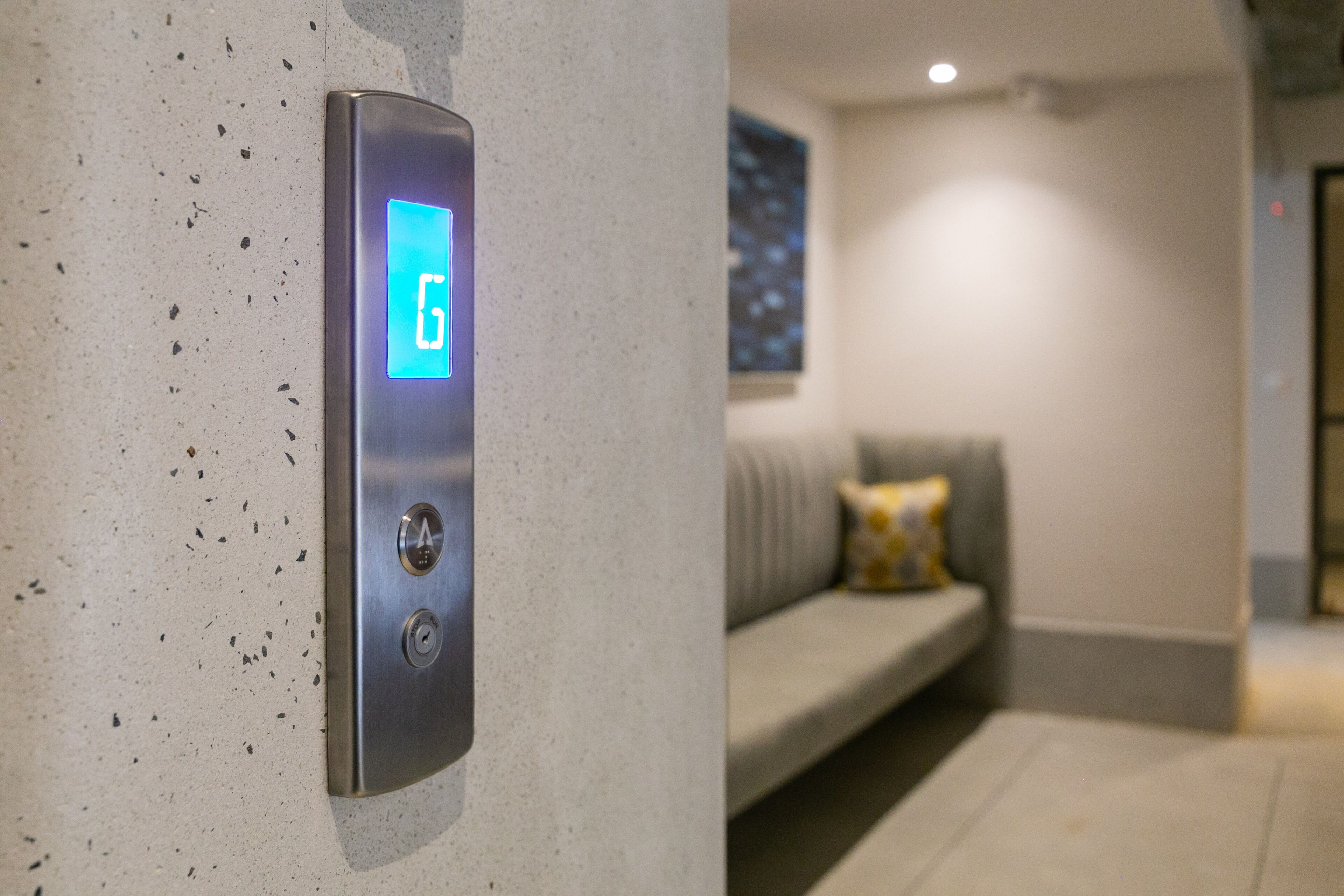 A modern elevator with a digital display indicating the floor number.