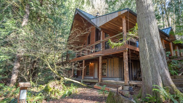 A cabin with a wooden exterior, multiple decks, and a forested setting. - Third night free on stays before 9/8/26 (Rhododendron)