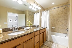 Combined shower/bathtub, hair dryer, towels, toilet paper
