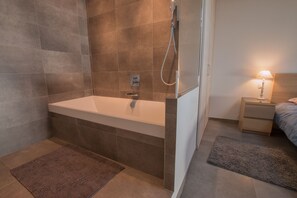 Combined shower/tub, hair dryer, towels, soap