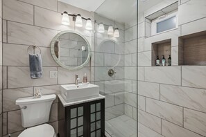 Shower, hair dryer, towels, soap