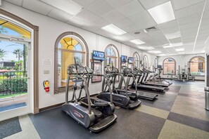A fitness center with multiple treadmills and exercise equipment. - Cozy Studio - 20 minutes from Disney - LOWEST price in Regal Palms Resort (Davenport)