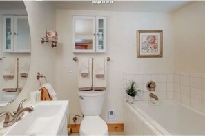 Combined shower/bathtub, hair dryer, towels, soap