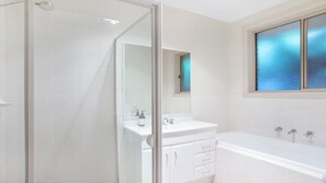 Bathtub, hair dryer, towels