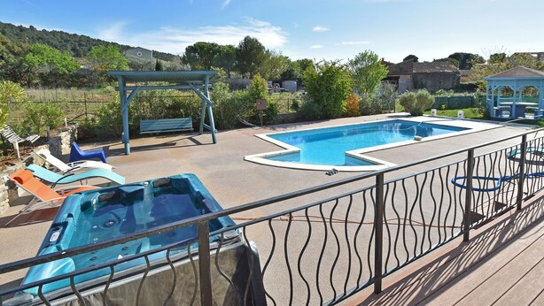 A swimming pool with a hot tub, lounge chairs, and a gazebo. - Beautiful Villa with Private Swimming Pool in Oupia (Oupia)