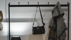 A wall-mounted coat rack with a lamp and a handbag. - Window to Acropolis (Athens)