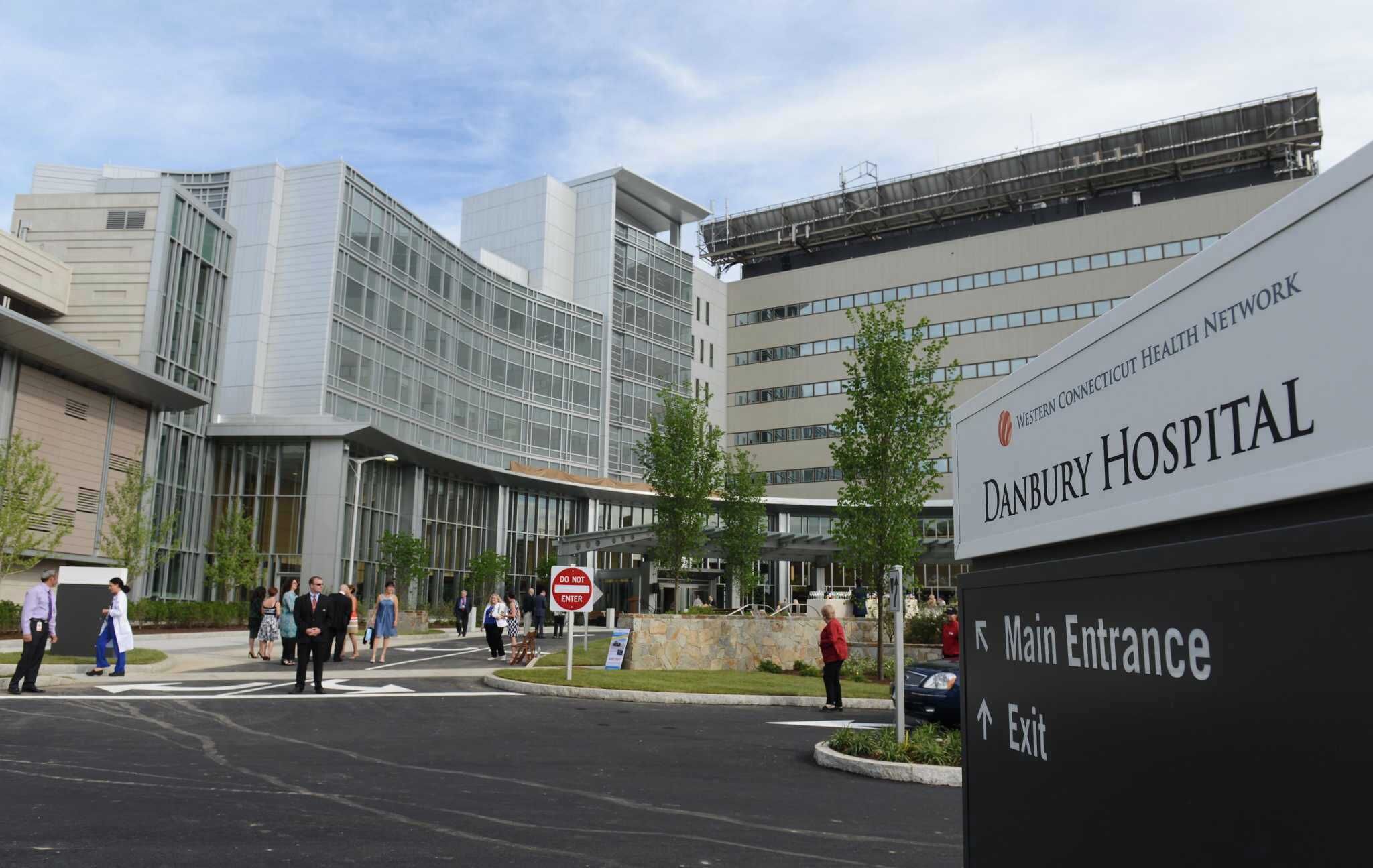 The entrance to Danbury Hospital with a clear sign indicating the main entrance and exit.