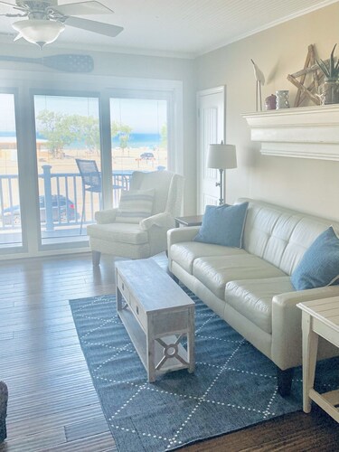 Right across from Beach and Grand Haven Pier!  Beautiful Lake and Sunset Views!