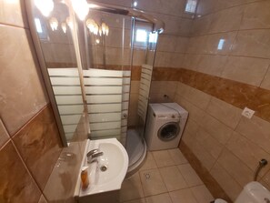 Shower, towels, soap, toilet paper