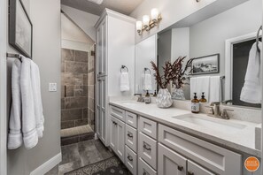 Combined shower/tub, hair dryer, towels, soap