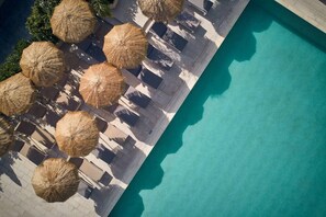 An aerial view of a poolside area with lounge chairs and thatched umbrellas. - Altura Hotel Zakynthos (Zakynthos)