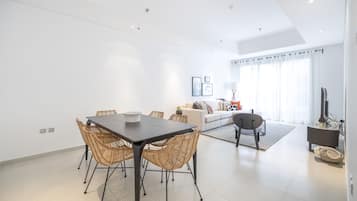 DHH - 2 Beds in A Great Location in Umm Al Sheif | Living area | 50-inch Smart TV with cable channels, TV