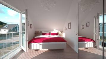 Un dormitorio con una cama grande, una ventana y vistas al exterior.