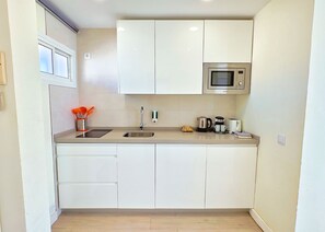 Fridge, microwave, coffee/tea maker, toaster