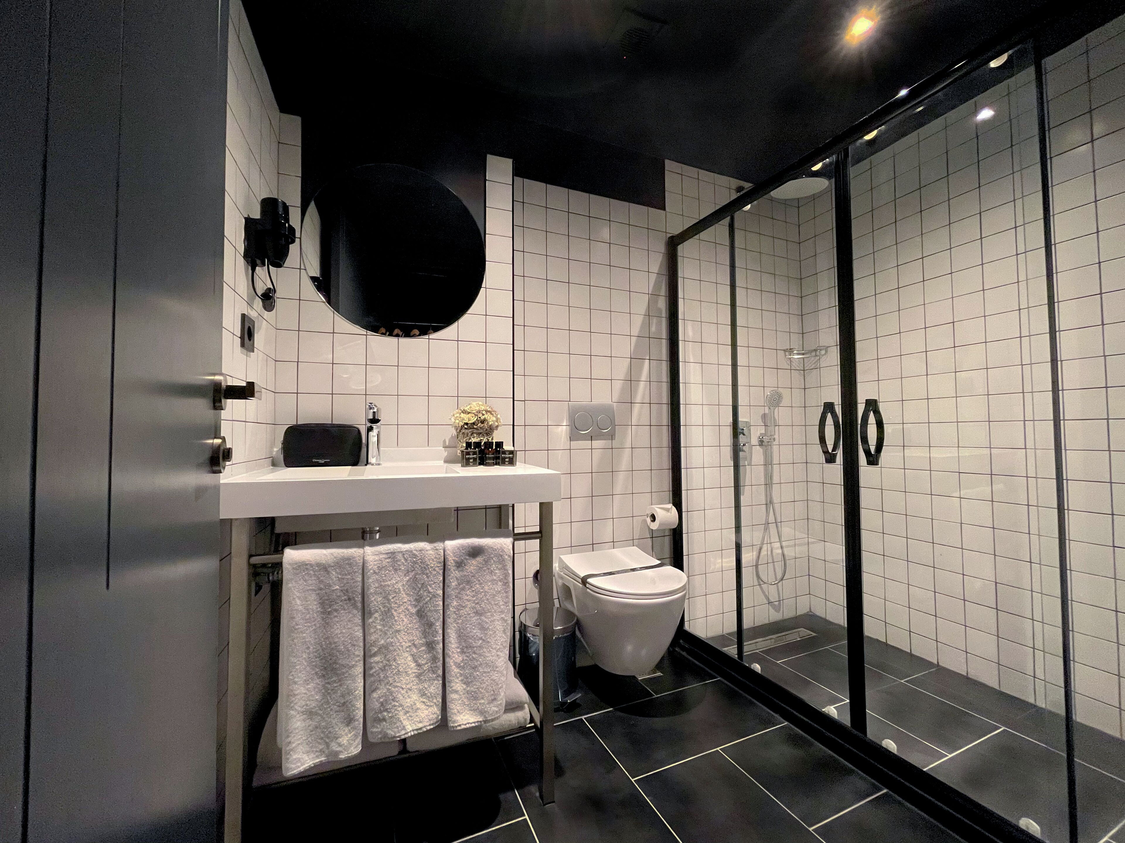 shower, hair dryer, bathrobes, slippers