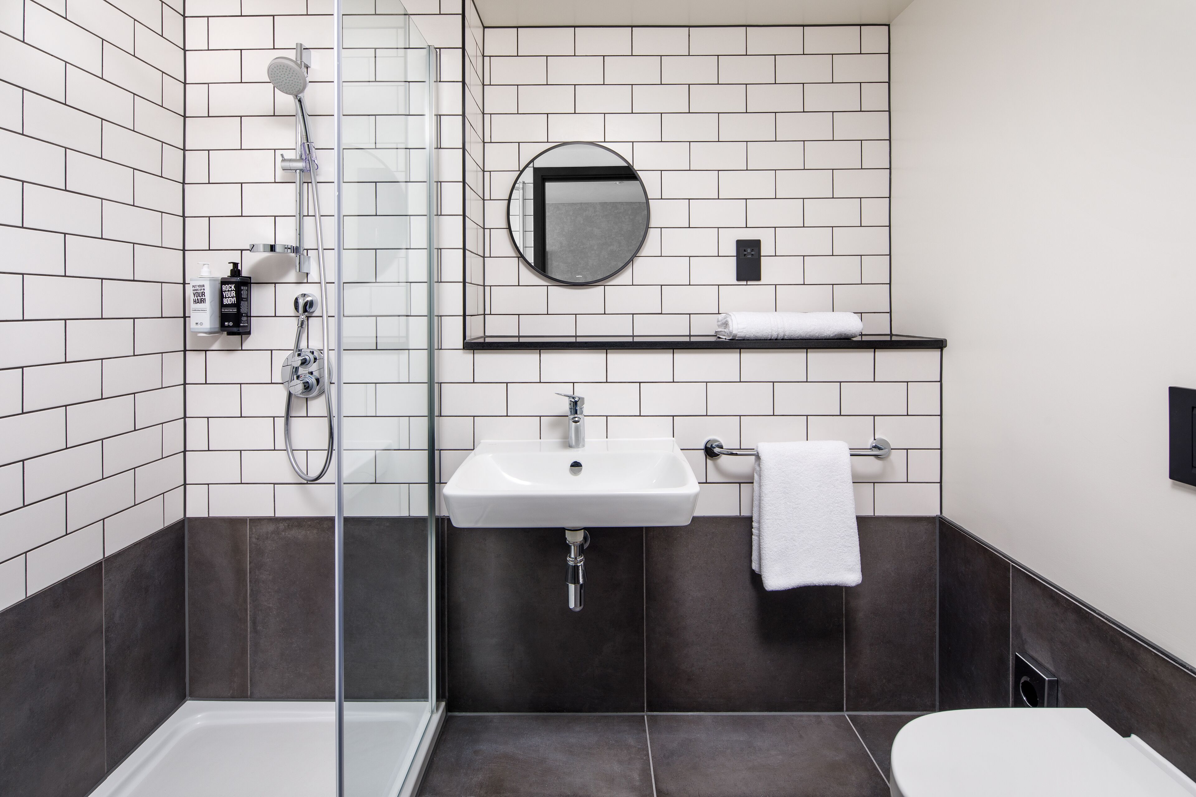 shower, rainfall showerhead, eco-friendly toiletries, towels