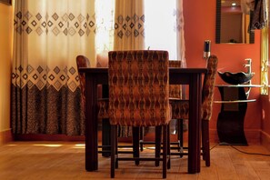 Family Apartment | Living area | 28-inch TV with digital channels - Faith Homes Hotel (Fort Portal)