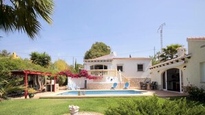 A house with a swimming pool, a patio with chairs, and a garden. - Villa- Amaya - Two Bedroom Villa, Sleeps 4 (Panorama)