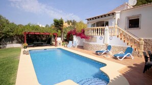 A swimming pool with a red pergola, lounge chairs, and a staircase leading to a balcony. - Villa- Amaya - Two Bedroom Villa, Sleeps 4 (Panorama)