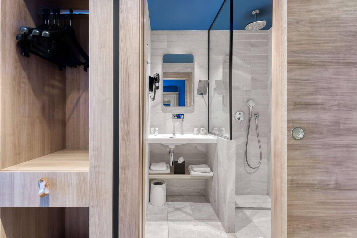 eco-friendly toiletries, hair dryer, towels