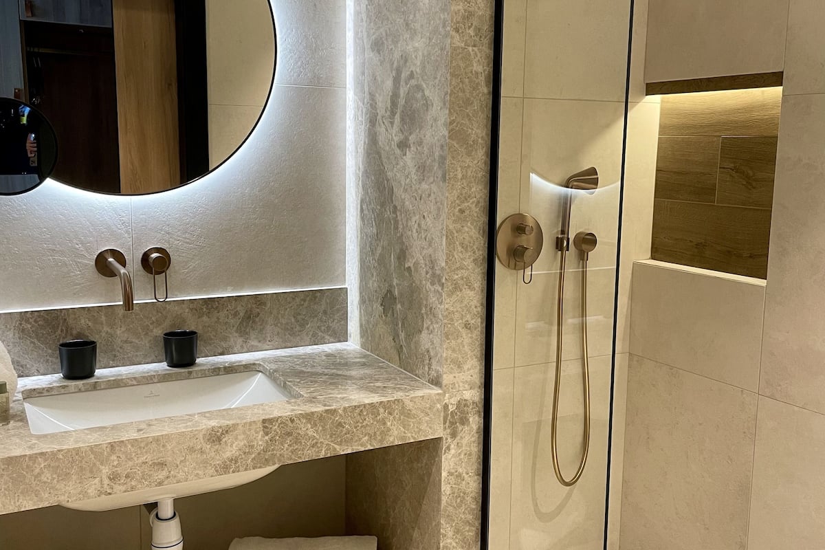 designer toiletries, hair dryer, towels, soap