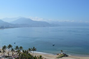 On the beach, sun loungers, beach towels