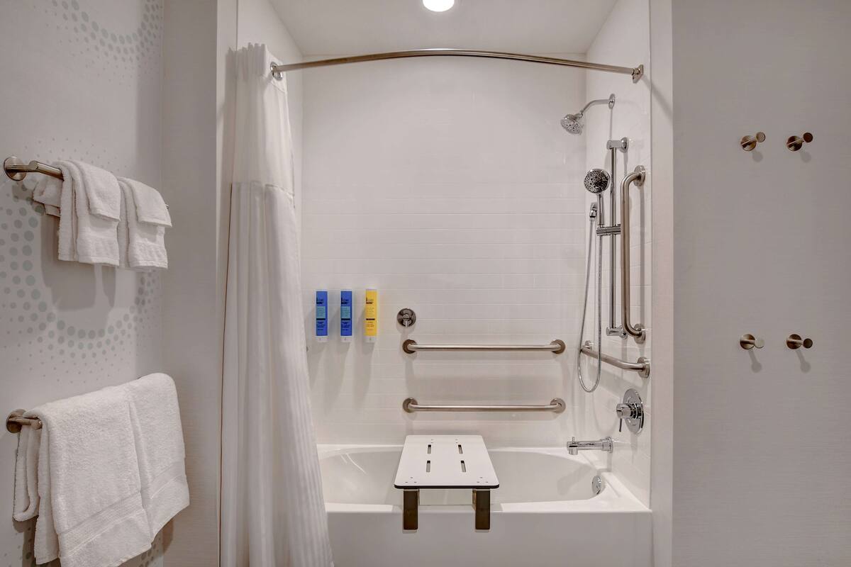 hair dryer, towels, soap, shampoo