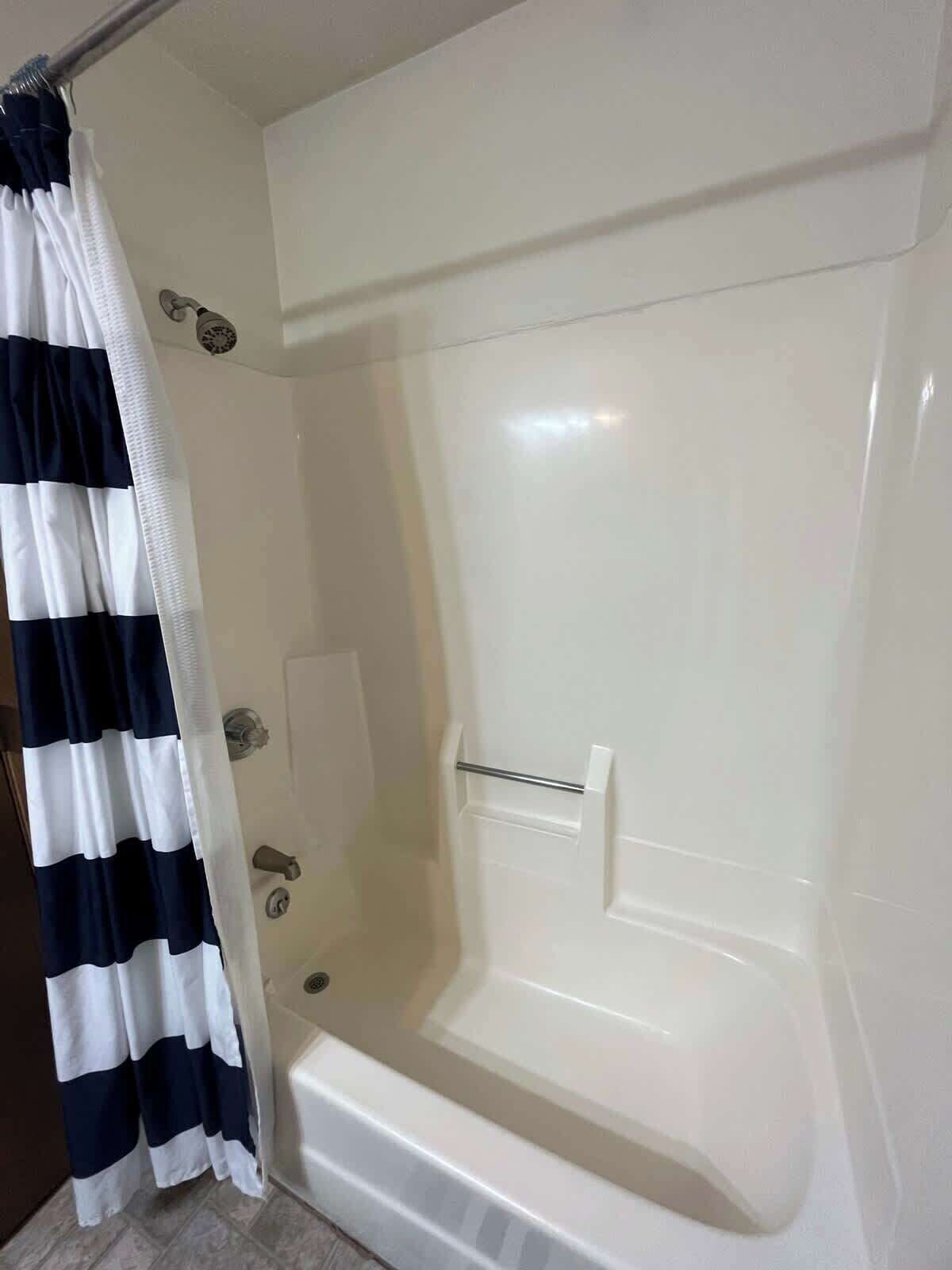 Bathtub, hair dryer, towels