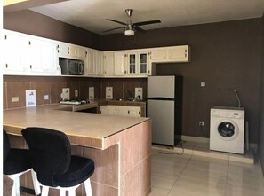 Microwave, electric kettle, toaster, cookware/dishes/utensils