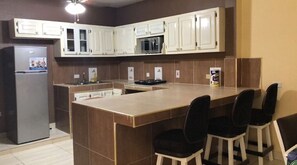 Microwave, electric kettle, toaster, cookware/dishes/utensils