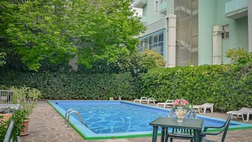 Seasonal outdoor pool, pool umbrellas