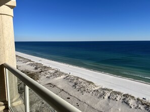 A beach view from a balcony with a clear sky. - 'Gulf Vibrations' Beach Club 4/4 Direct 𝓖𝓾𝓵𝓯 𝓕𝓻𝓸𝓷𝓽 15th Fl Luxury Condo (Pensacola Beach)