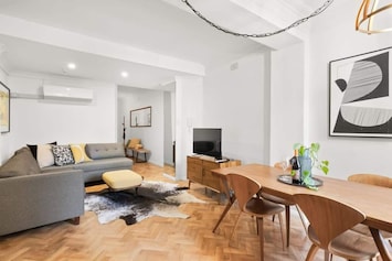 The expansive living and dining area, complete with a large TV - perfect for watching Netflix! Photography by Love Space Photography, NSW, Australia