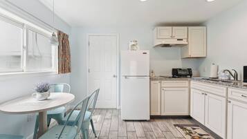 Microwave, coffee/tea maker, dining tables