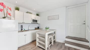 Microwave, coffee/tea maker, dining tables