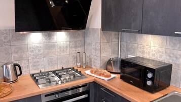 Family Cottage, Ensuite (4 étoiles) | Shared kitchen