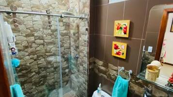 Shower, towels, soap, toilet paper