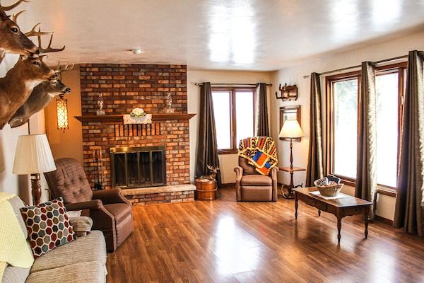 Living Room with large windows overlooking our pond
