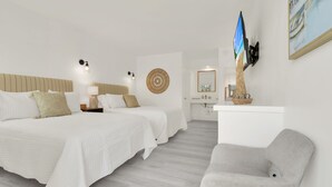 A hotel room with two beds, a TV, a desk, and a chair. - Boutique Hotel 2 double beds with POOL, LOCATION! 1 block to BEACH/Restaurants (Deerfield Beach)